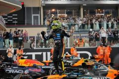 McLaren driver Lando Norris of Britain reacts after becomin a rold champion after the Abu Dhabi Formula One Grand Prix in Abu Dhabi, United Arab Emirates, Sunday, Dec. 7, 2025. (AP Photo/Darko Bandic)